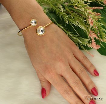 Bransoletka sztywna srebrna pozłacana kryształ Swarovski BBRG1122C. Sztywna bransoletka wykonana z najwyższej próby srebra pokryta warstwą 18 karatowego żółtego złota. Biżuteria o stosunkowej sztywnej formie zakończona kryształkami.jpg