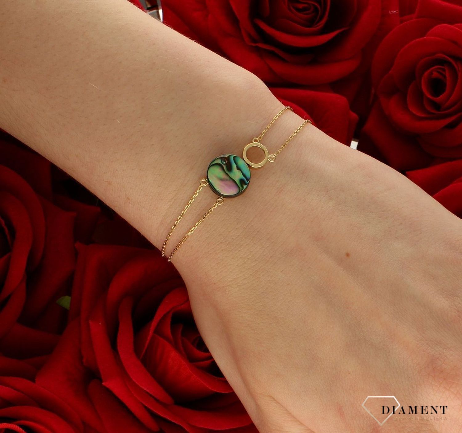 Srebrna bransoletka damska pokryta złotem z muszlą 0728158500.  Delikatna bransoletka wykonana z najwyższej próby srebra 925 pokryta 24-karatowym złotem z muszlą naturalną w organicznej ramce. Idealny pomysł na prezent.  (1).jpg