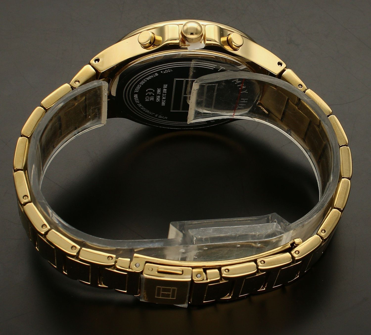 Złoty zegarek damski  TOMMY HILFIGER 1782599 z czarną tarczą i białymi indeksami.jpg