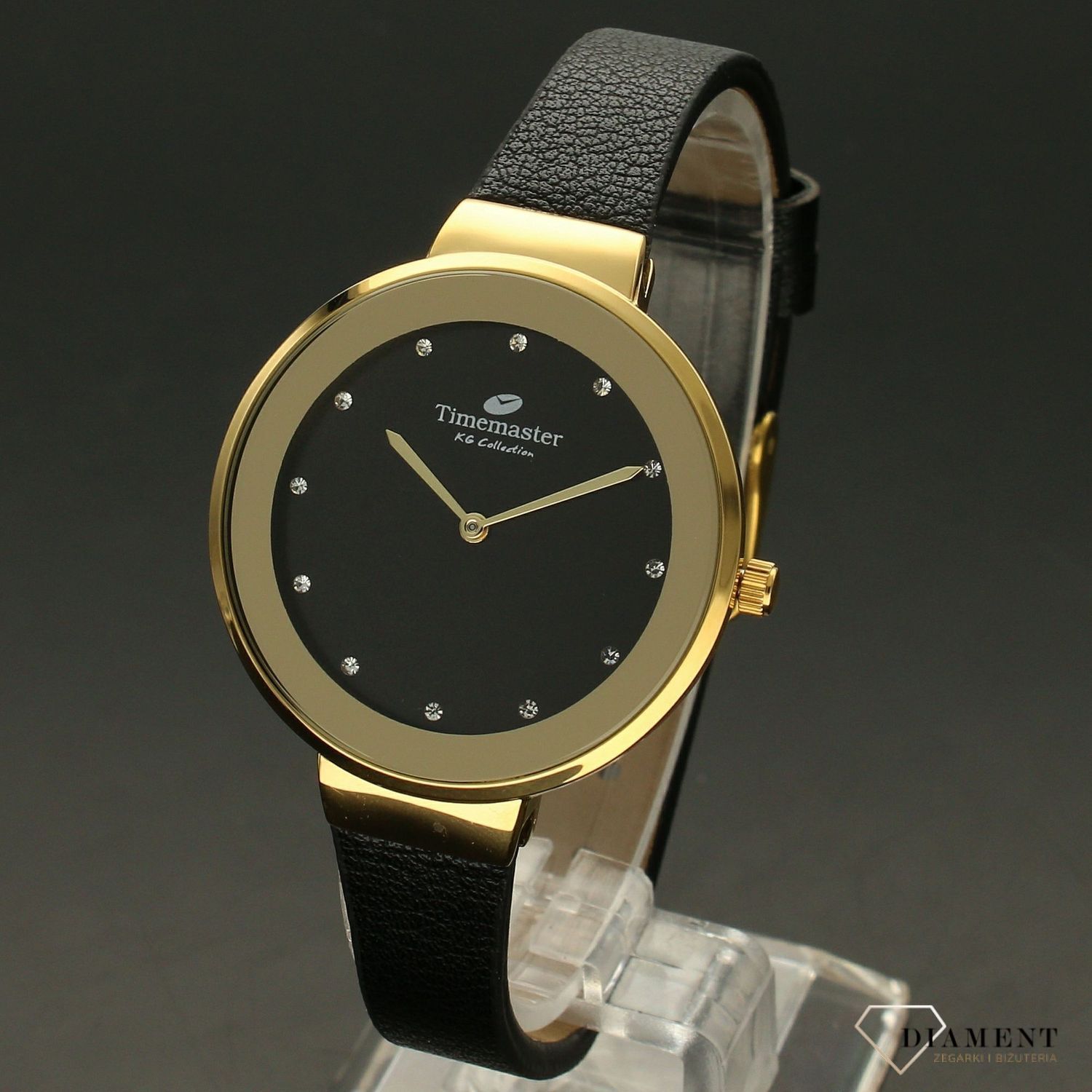 Zegarek damski w kolorze złotym na czarnym paski TIMEMASTER 206-8. Zegarek damski z pozłacaną okrągłą kopertą w kolorze złotym. Zegarek z czarnym skórzanym paskiem. Tarcza w kolorze czarnym z błyszczącymi cyrkoniami. Świetny p.jpg