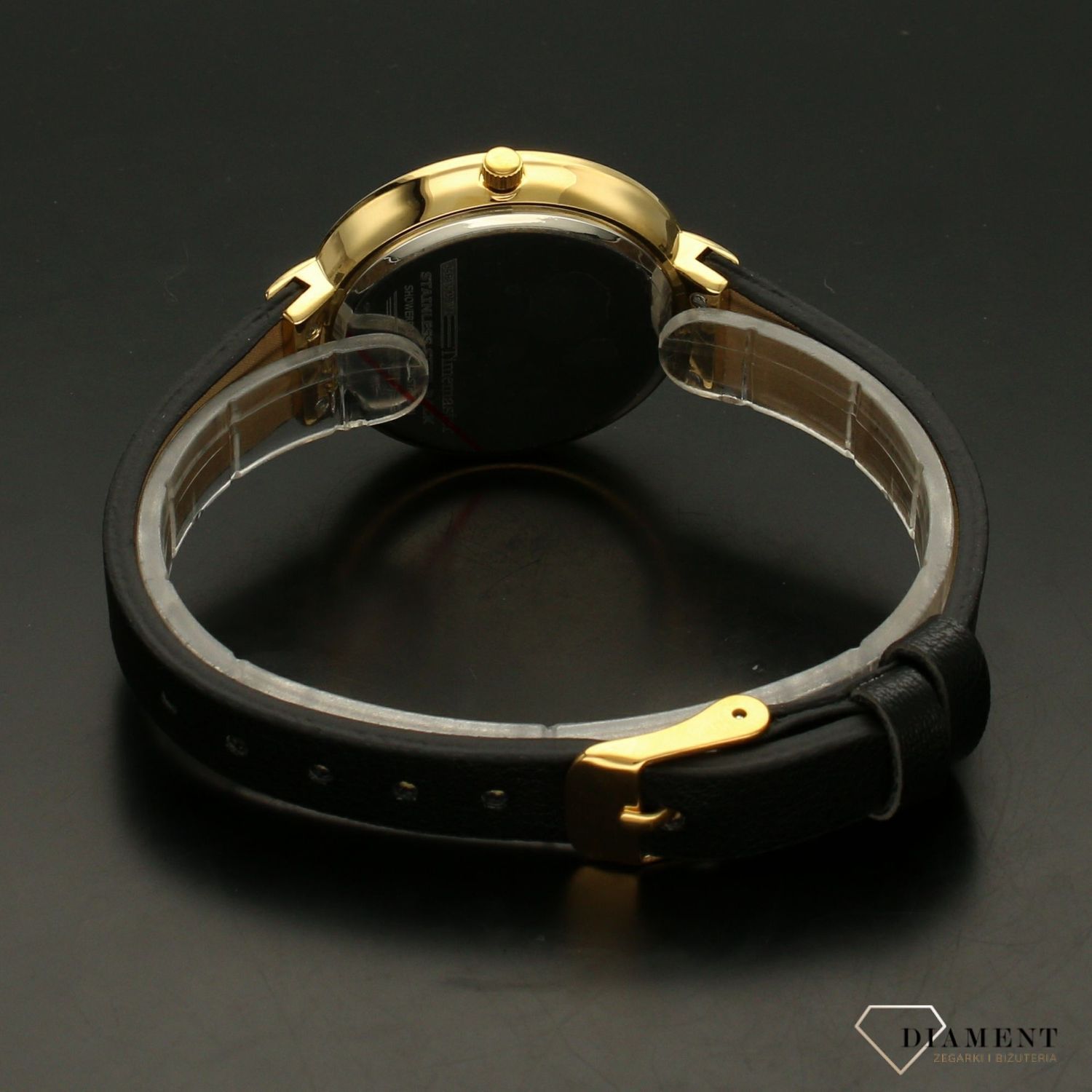 Zegarek damski w kolorze złotym na czarnym paski TIMEMASTER 206-8. Zegarek damski z pozłacaną okrągłą kopertą w kolorze złotym. Zegarek z czarnym skórzanym paskiem. Tarcza w kolorze czarnym z błyszczącymi cyrkoniami. Świetny p.jpg