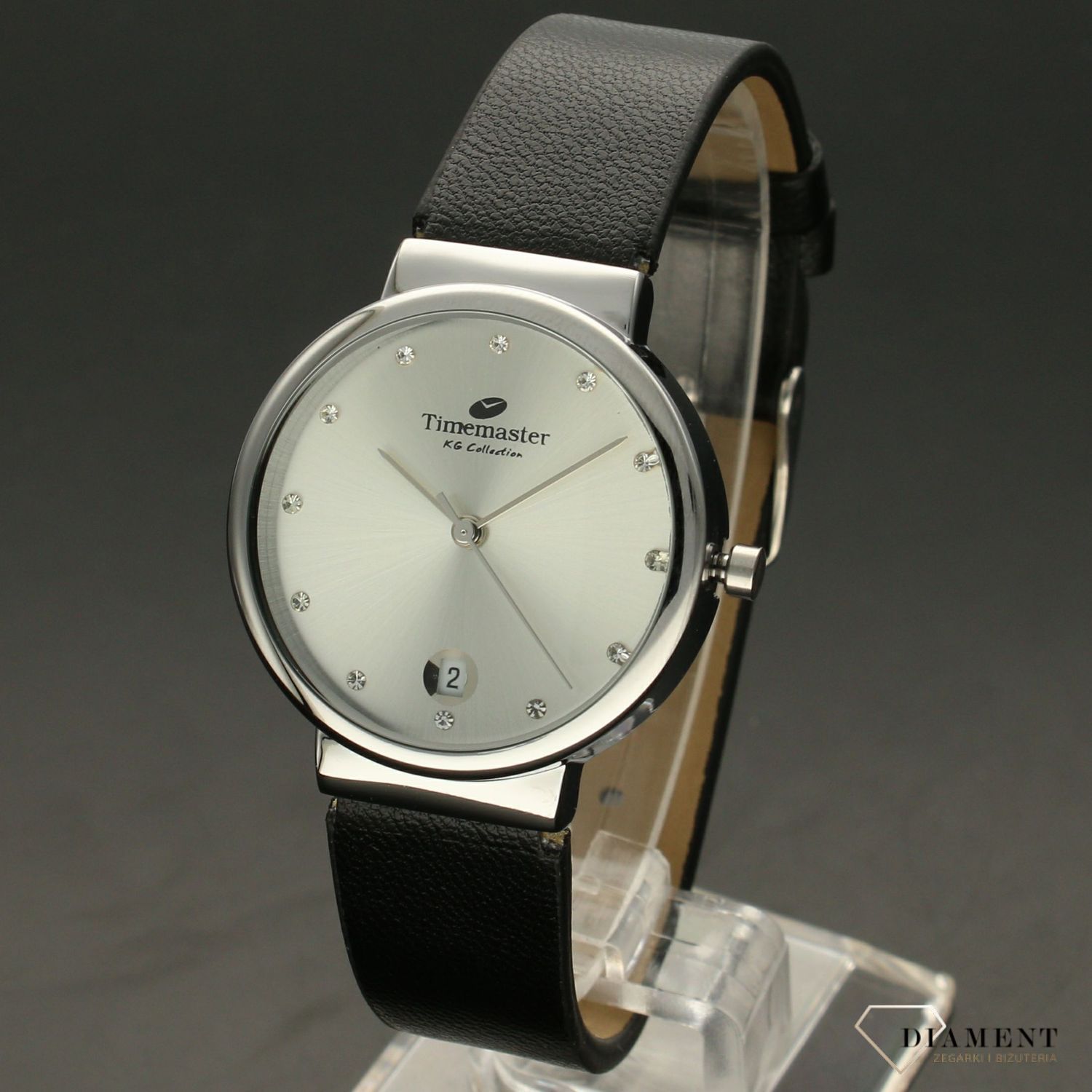 Zegarek damski TIMEMASTER 208-1S czarny pasek. Zegarek damski zachowany w klasycznej formie. Tarcza zegarka w kolorze srebrnym z wyraźnym datownikiem w formie popularnego okienka. Indeksy w formie cyrkonii.  (2).jpg