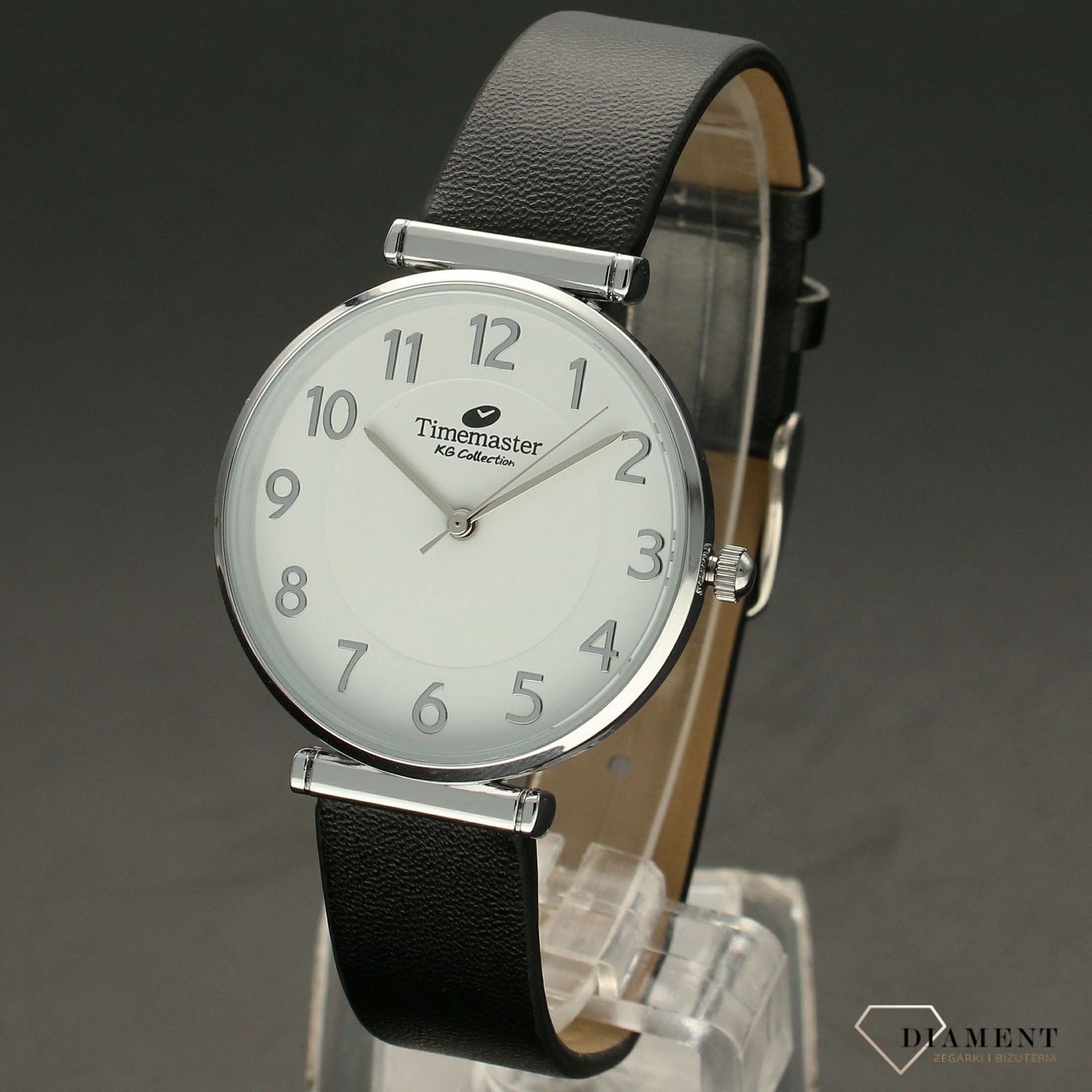 Zegarek damski TIMEMASTER klasyczny 208-38. Zegarek damski zachowany w klasycznej formie. Zegarek damski. Zegarek z białą tarczą z wyraźnymi srebrnymi cyframi arabskimi. Pasek skórzany w kolorze czarnym.  (2).jpg