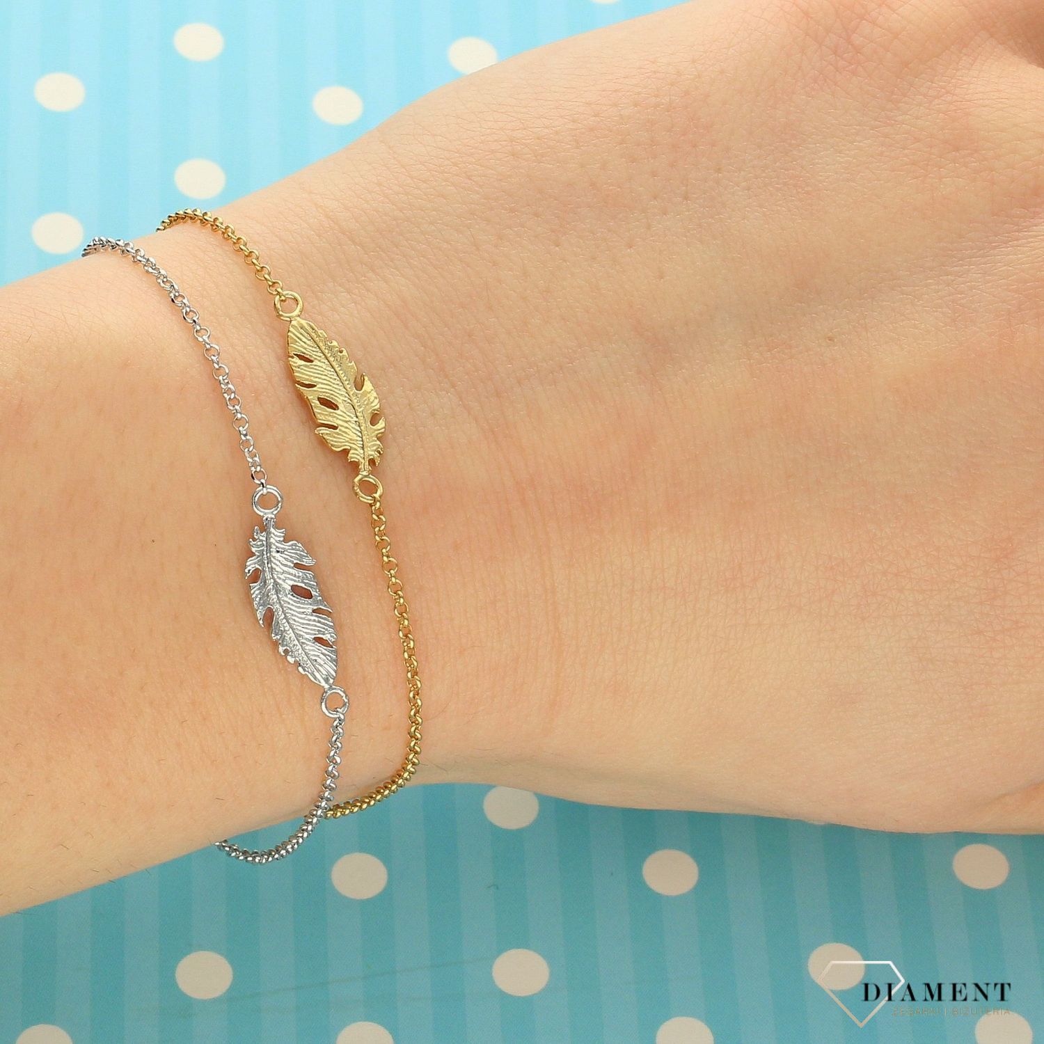 Srebrna bransoletka z piórem 272420760200.jpg