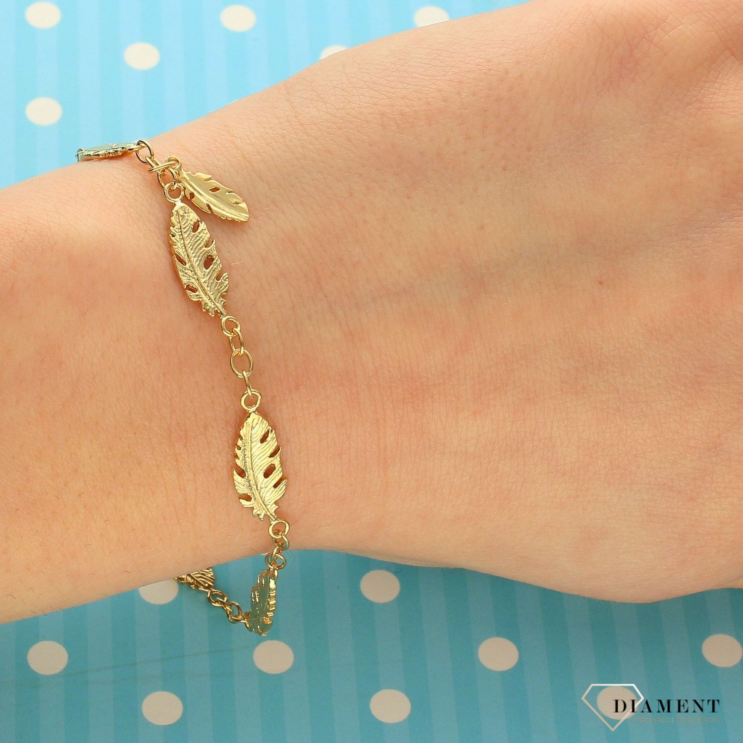 Srebrna bransoletka damska pozłacana z piórami 272433340450.jpg