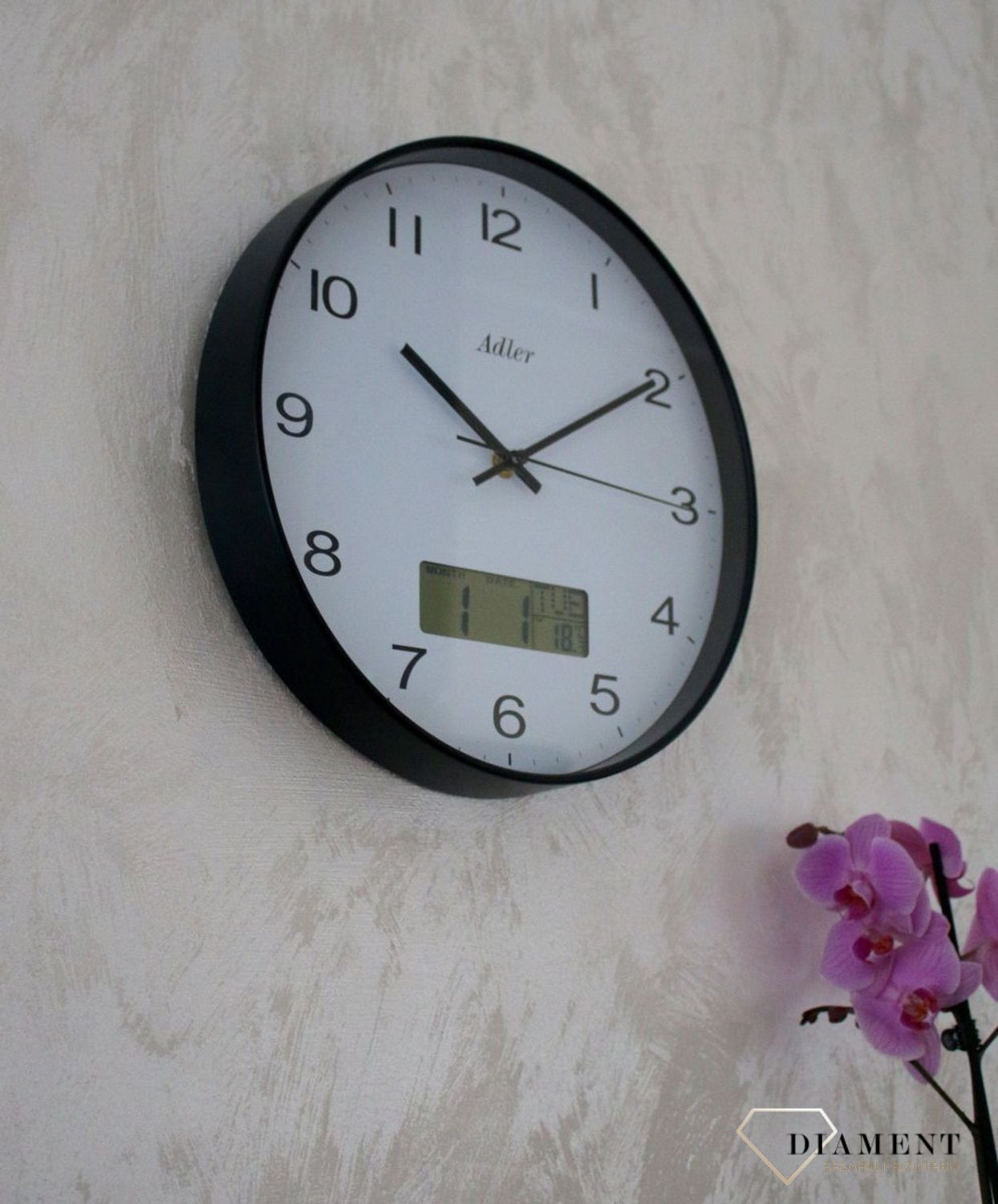 Zegar ścienny okrągły Adler Czarny z datownikiem i termometrem 30172. Zegar ścienny Adler okrągły wyposażony jest w kwarcowy mechanizm, zasilany za pomocą baterii.  (5).JPG