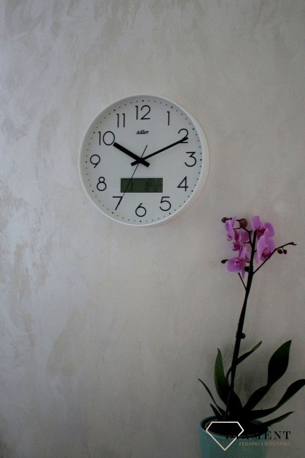 Zegar ścienny okrągły Adler Biały z datownikiem i termometrem 30173. Zegar ścienny Adler okrągły wyposażony jest w kwarcowy mechanizm, zasilany za pomocą baterii (1).JPG