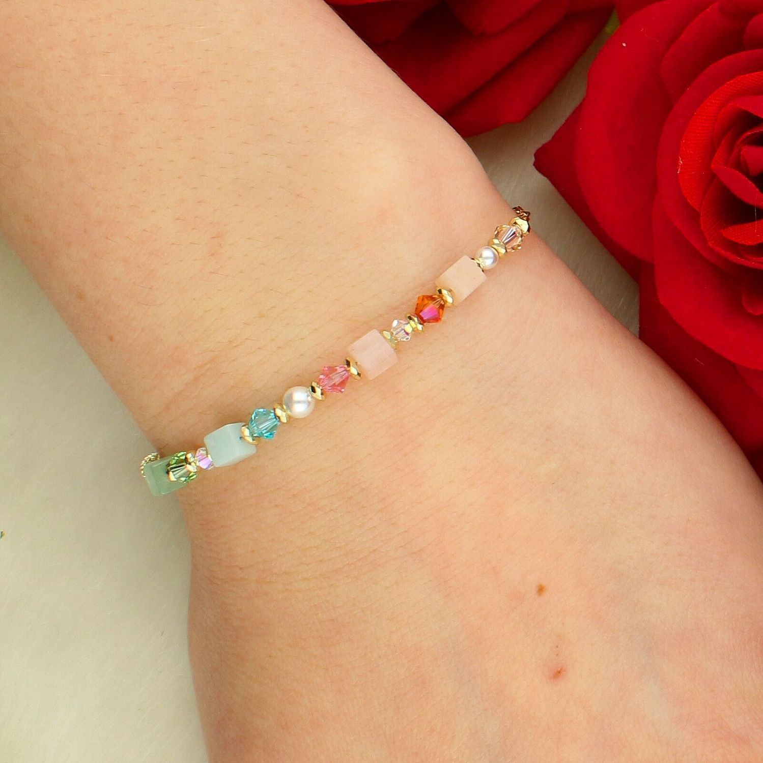 Bransoletka damska Coeur de Lion Cube Princess Fusion Blossom 3031301537 – złota, pastelowa elegancja.jpg