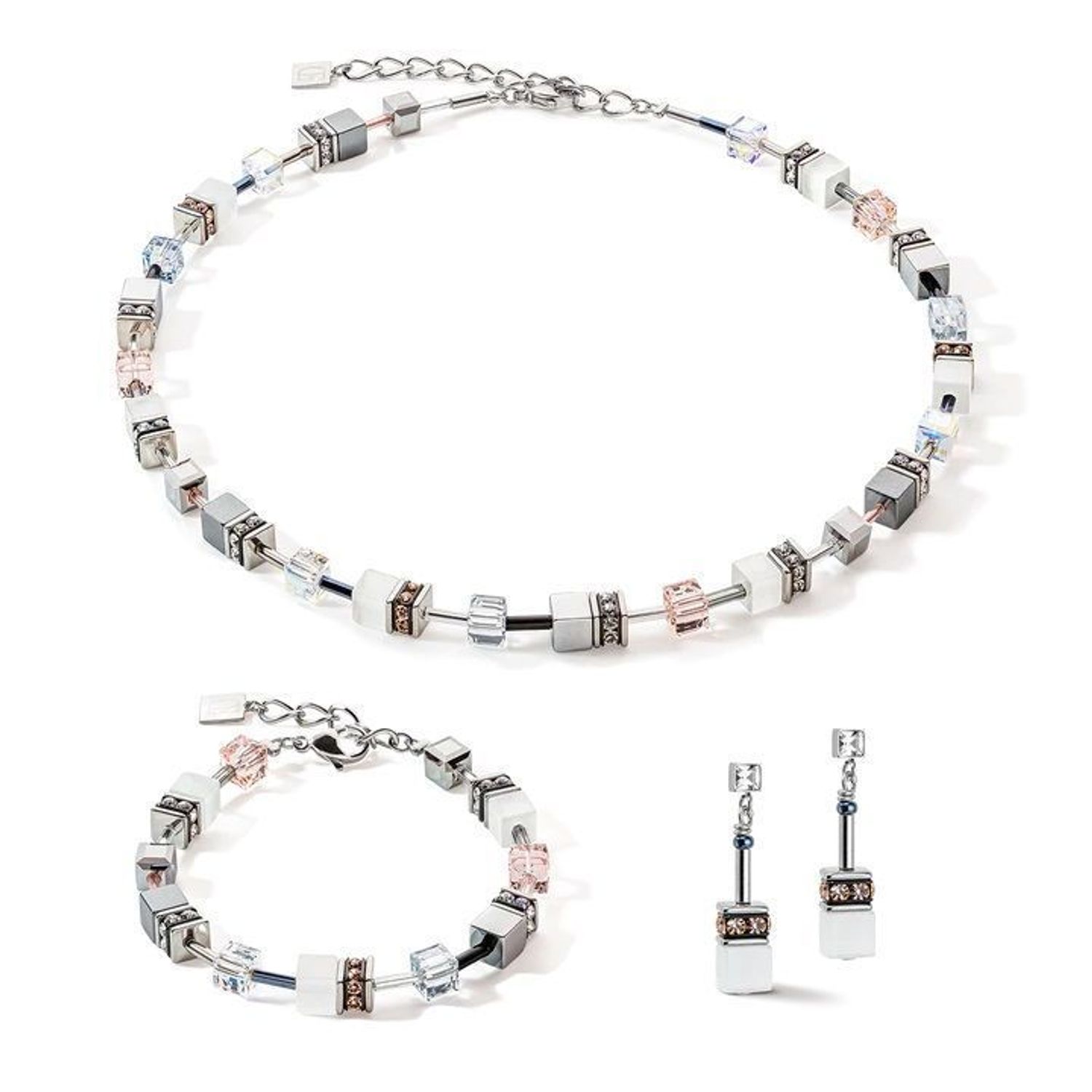 Coeur De Lion GeoCUBE® Iconic Monochrome Earrings w kolorze brzoskwiniowym. Eleganckie kolczyki 2,9 cm ze stali nierdzewnej, kryształów i oka tygrysa.22.jpg