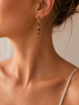 Kolczyki Coeur de Lion Golden Whisper z kryształami Swarovski® i hematytem. Brązowo-czerwono-złota kolorystyka, długość 3 cm, elegancki design.d.jpg