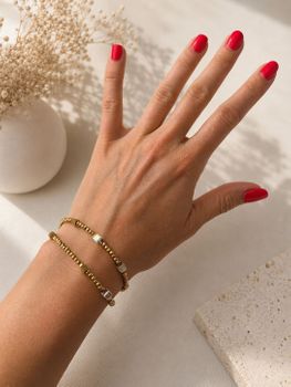 Złota bransoletka damska Coeur de Lion Joyful Colours Flex Gold z kryształami Swarovski®, hematytem i stalą nierdzewną. Można nosić ją również jako choker (1).jpg