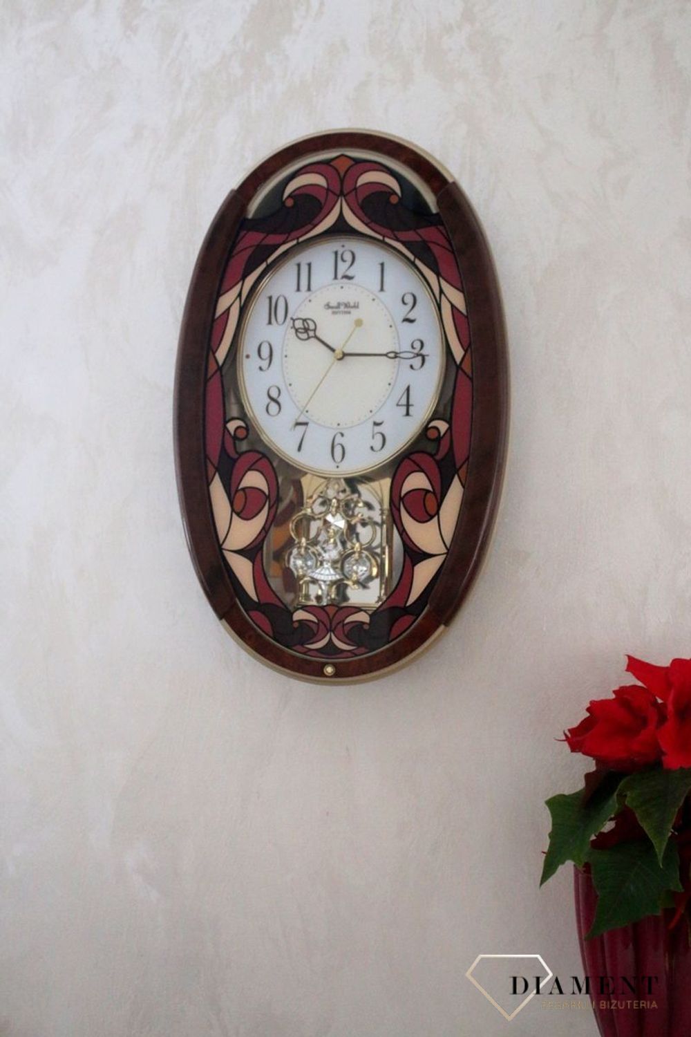 Dekoracyjny zegar ścienny Rhythm 4MJ430WD01 z 22 melodiami, szkłem z kolorowym witrażem i japońskim mechanizmem kwarcowym. Styl i precyzja dla Twojego salonu..jpg