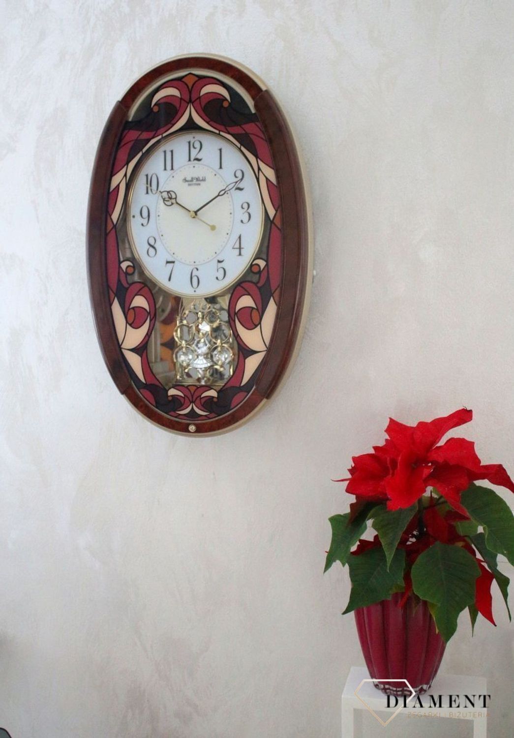 Dekoracyjny zegar ścienny Rhythm 4MJ430WD01 z 22 melodiami, szkłem z kolorowym witrażem i japońskim mechanizmem kwarcowym. Styl i precyzja dla Twojego salonu..jpg