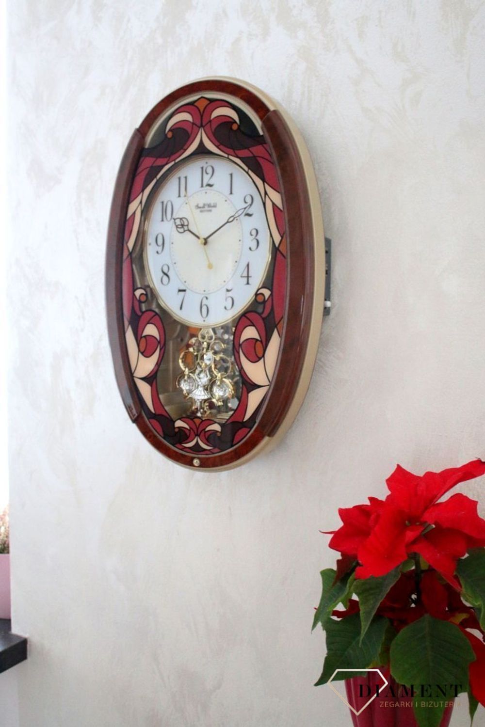 Dekoracyjny zegar ścienny Rhythm 4MJ430WD01 z 22 melodiami, szkłem z kolorowym witrażem i japońskim mechanizmem kwarcowym. Styl i precyzja dla Twojego salonu..jpg