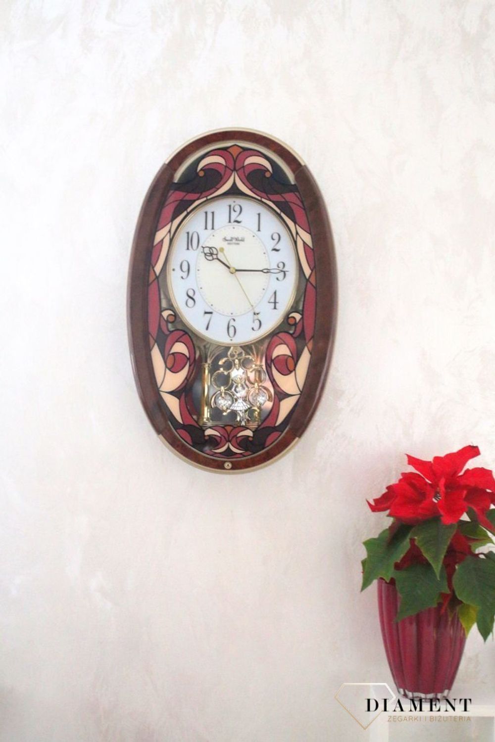 Dekoracyjny zegar ścienny Rhythm 4MJ430WD01 z 22 melodiami, szkłem z kolorowym witrażem i japońskim mechanizmem kwarcowym. Styl i precyzja dla Twojego salonu..jpg