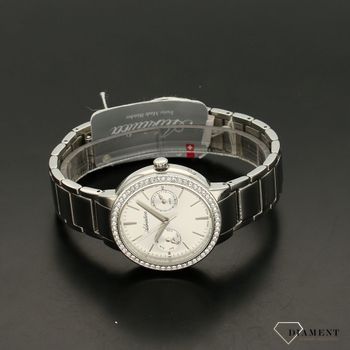 Zegarek damski biżuteryjny z piękną stalową bransoletą. Tarcza zegarka dookoła jest ozdobiona kryształami Swarovskiego. Tarcza zegarka w srebrnym kolorze.  (4).jpg