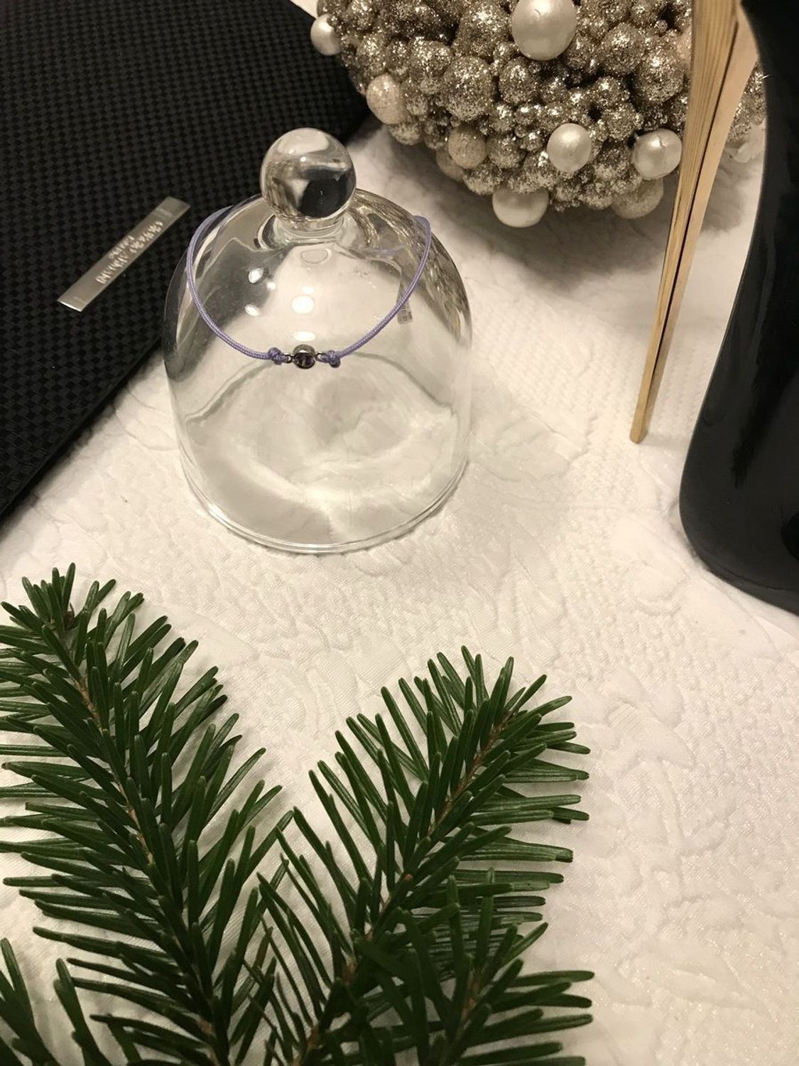 Bransoletka Apart na sznurku fioletowa z cyrkonią  Bransoletka wykonana z fioletowego sznurka i fioletowej cyrkonii w srebrnej oprawie Bransoletki na sznurku3.jpg