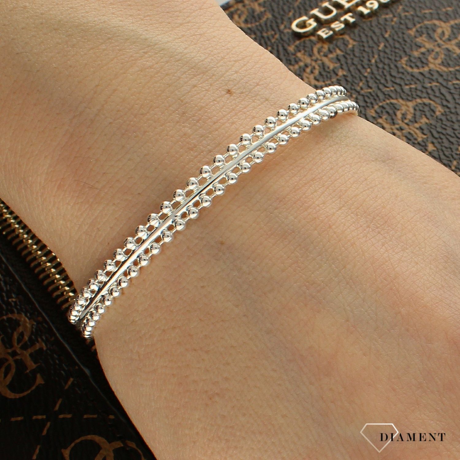 Bransoletka sztywna KARPIŃSKI w kolorze srebra B14141AG (2).jpg