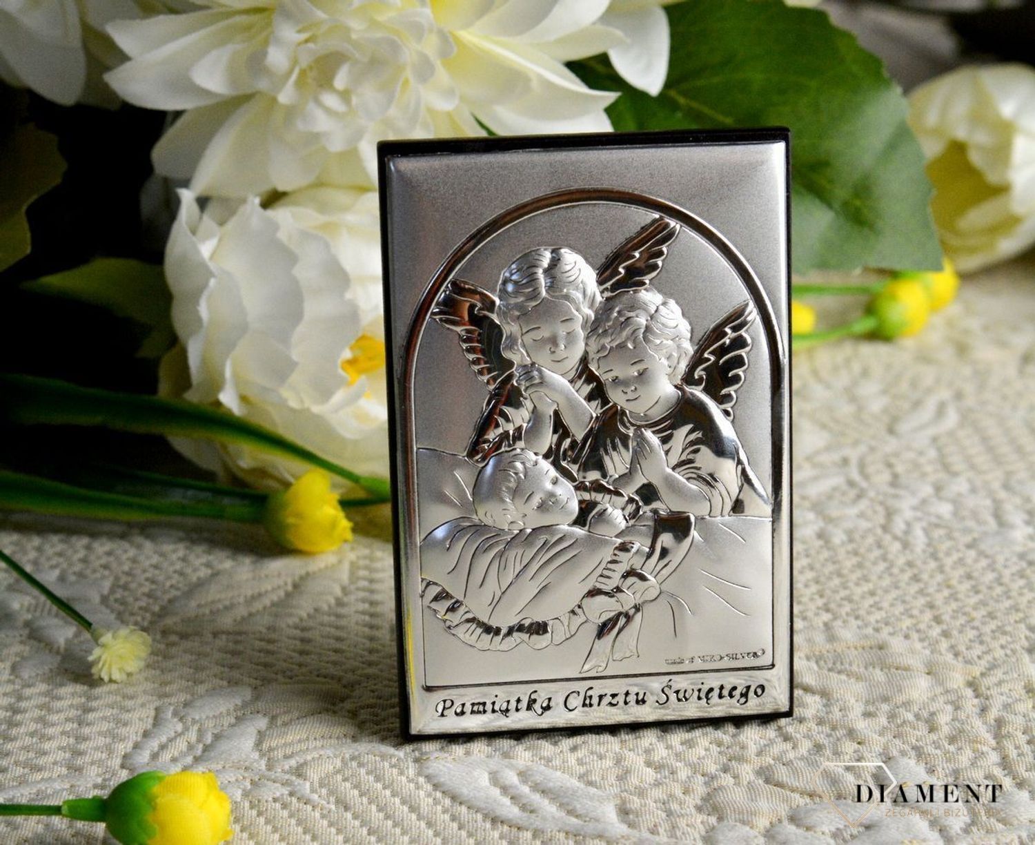 Obrazek srebrny przedstawiający Aniołki to idealny upominek z okazji Chrztu Świętego, który powinien zagościć w każdym dziecięcym pokoju wnosząc radość.  Wykonany z wysokiej jakości d.jpg