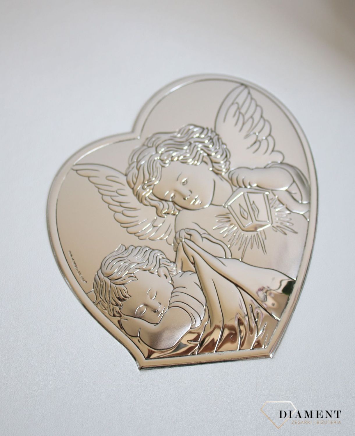 Album do zdjęć pamiątka Chrztu, roczku. Album na zdjęcia produkowany ze skóry organicznej. Na okładce znajduje się posrebrzany obrazek z motywem Aniołków. 1.JPG