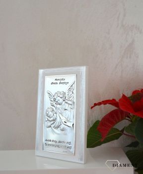 Obrazek przedstawiający wizerunek Anioła Stróża z dzieciątkiem, wykonany techniką laminatu z aluminium i srebra. To znakomita ozdoba każdego dziecięcego pokoju. Pamią (1).JPG