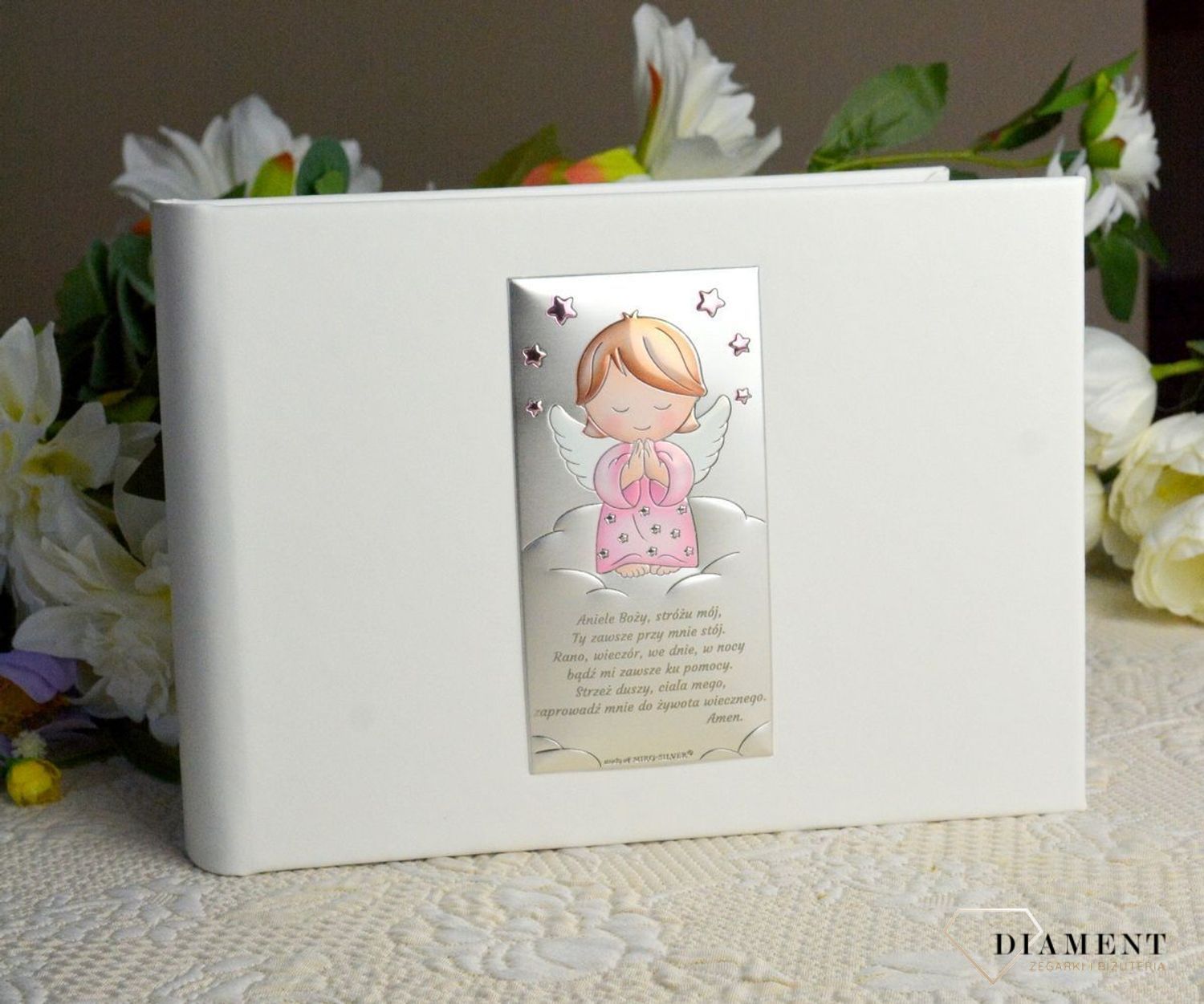 Album na chrzest, roczek dla dziecka. Album na zdjęcia produkowany ze skóry organicznej. Na okładce znajduje się posrebrzany obrazek z motywem różowego Aniołka..jpg