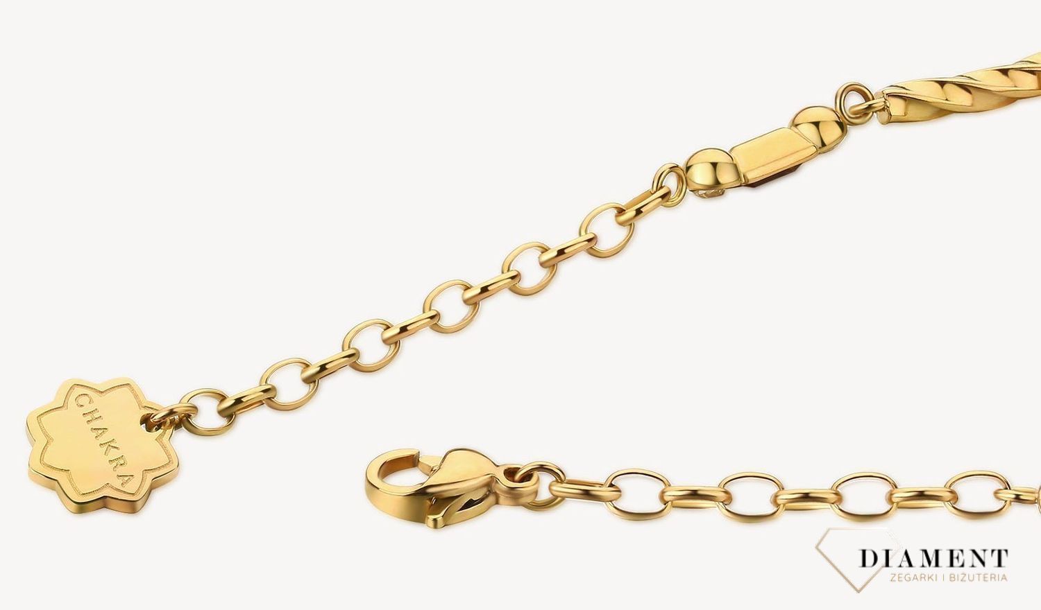 Bransoletka damska stalowa BROSWAY '' Chakra Mistyczna'' BHKB113 💎 Bransoletka wykonana ze stali w kolorze złotym 💎 Bransoletka z kwiatem lotosu, kryształami w złotym cieniu, jasnym złotym kwarcem i przydymionym topazem .jpg