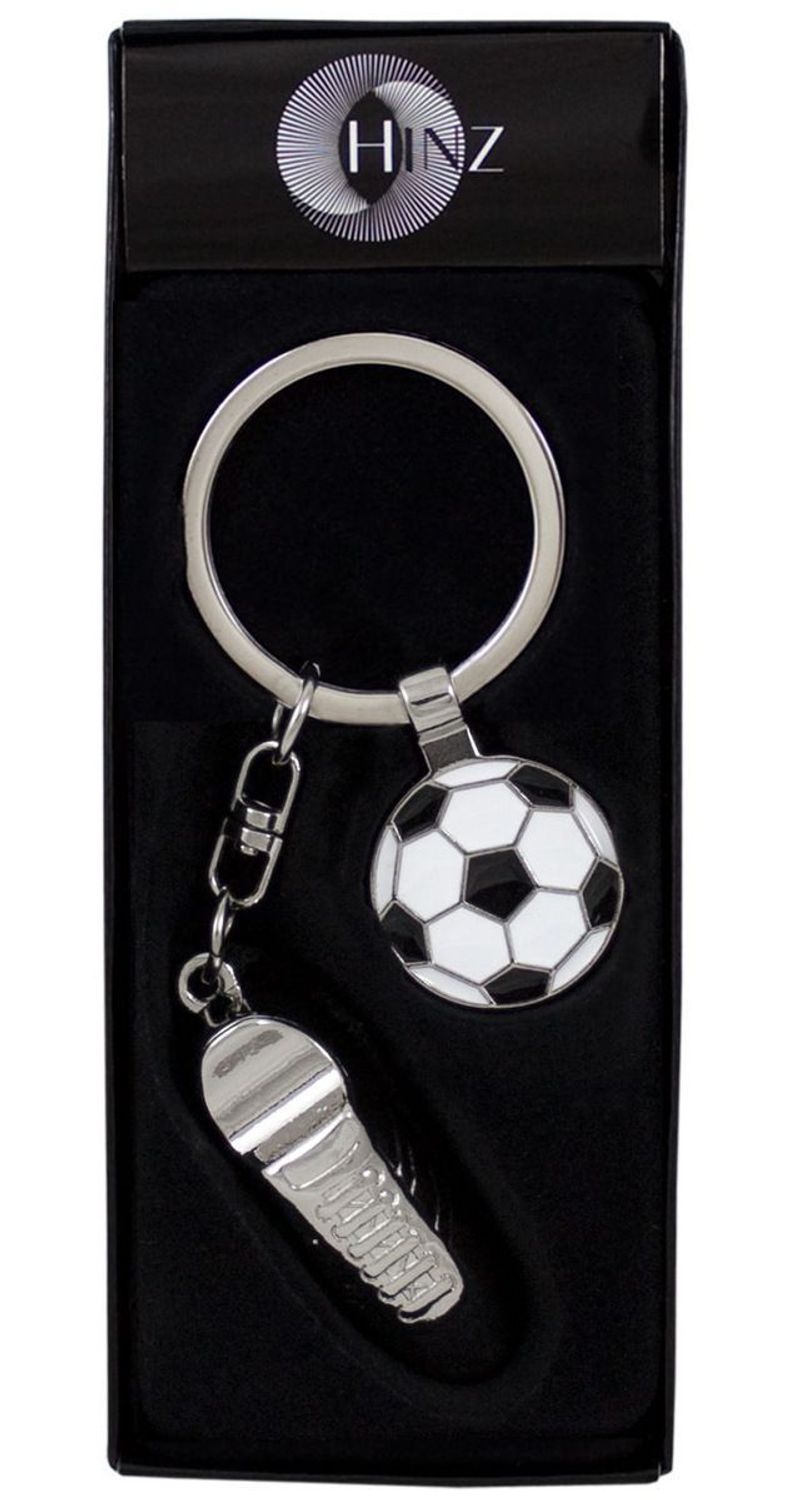 Brelok BR362 z butem piłkarskim i piłką nożną. Błyszczący metal, miejsce na grawer, długość 10 cm. Pakowany w eleganckie pudełeczko – idealny prezent dla fana futbolu.1.jpg
