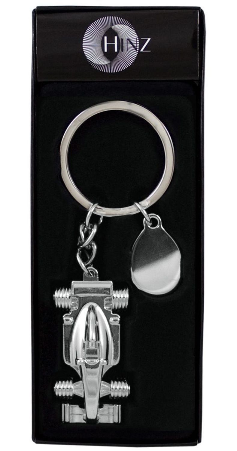 Metalowy brelok BR363 w kształcie bolidu F1 z zawieszką do graweru. Długość 11 cm, opakowany w eleganckie czarne pudełko z flokowanym wnętrzem. Idealny jako prezent lub gadżet firmowy.1.jpg