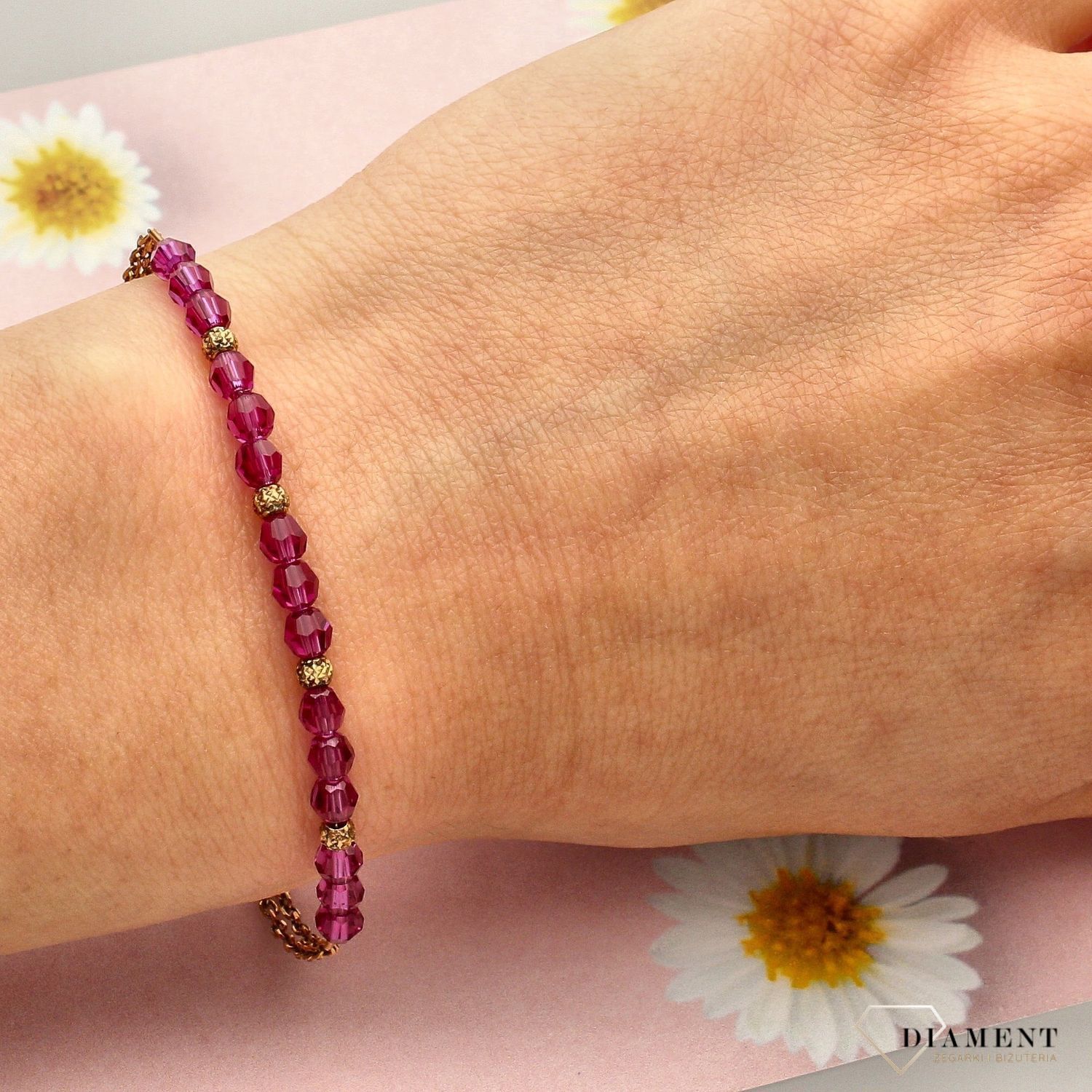 Bransoletka damska wykonana ze srebra próby 925. Bransoletka została ozdobiona różowymi kryształami Swarovskiego (1).jpg