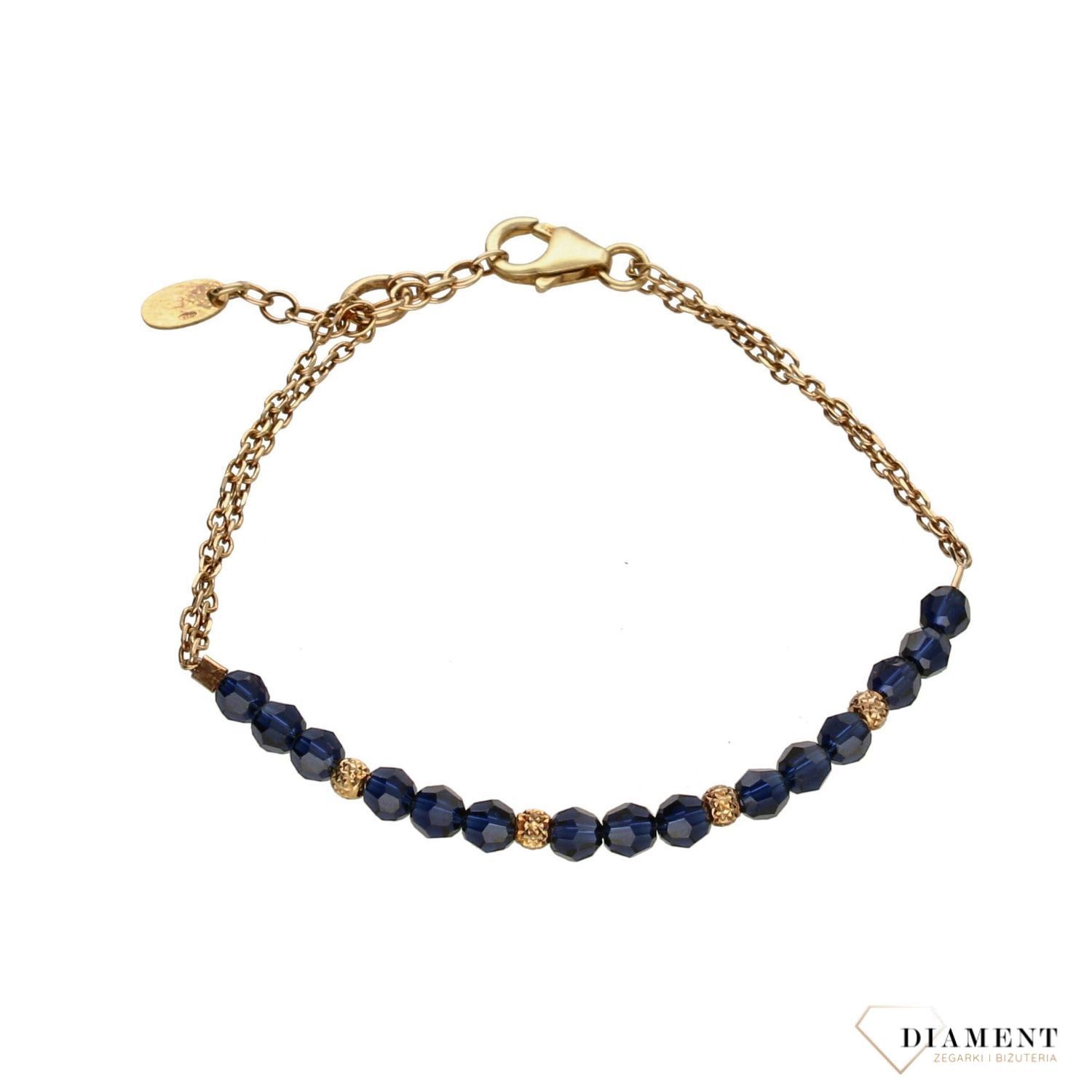Piękna bransoletka w kolorze złota ozdobiona granatowymi kryształami Swarovskiego. Idealny pomysł na prezent dla kobiety. Bransoletkę można łączyć z inną biżuterią..jpg