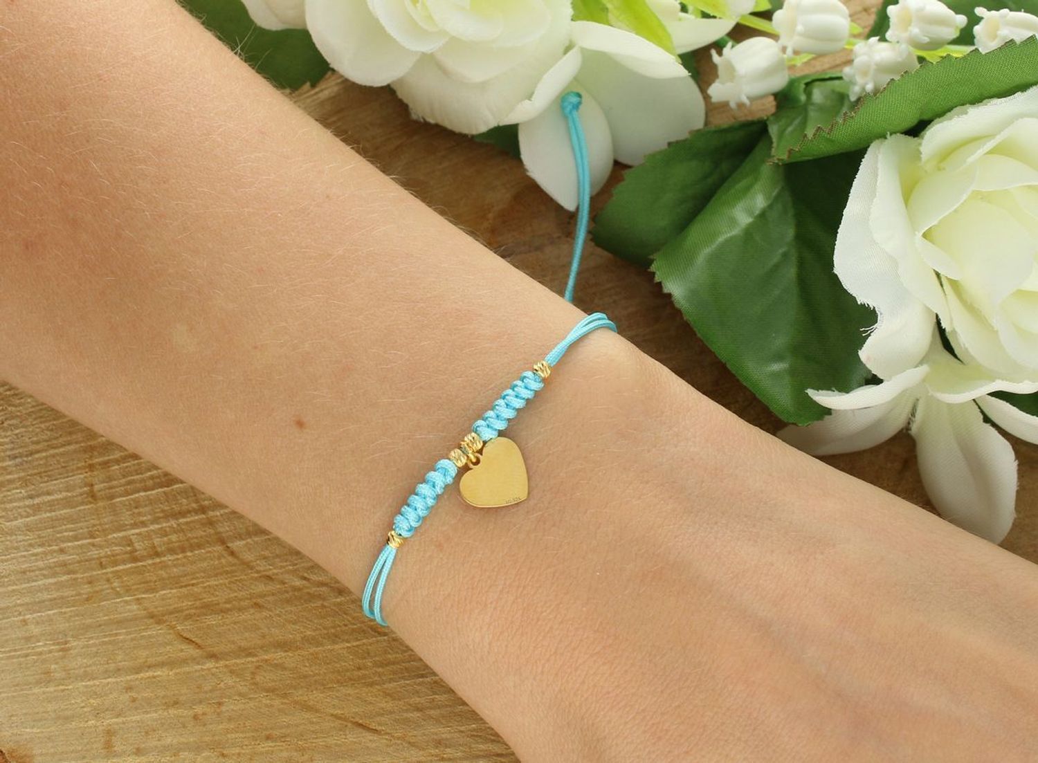 Bransoletka srebrna pozłacana 925 BS3245v53, na niebieskim sznureczku z gładką zawieszką serduszkiem (1,0 cm x 9 mm). Waga 0,75 g. Regulowane zapięcie. Subtelna i elegancka.1.jpg