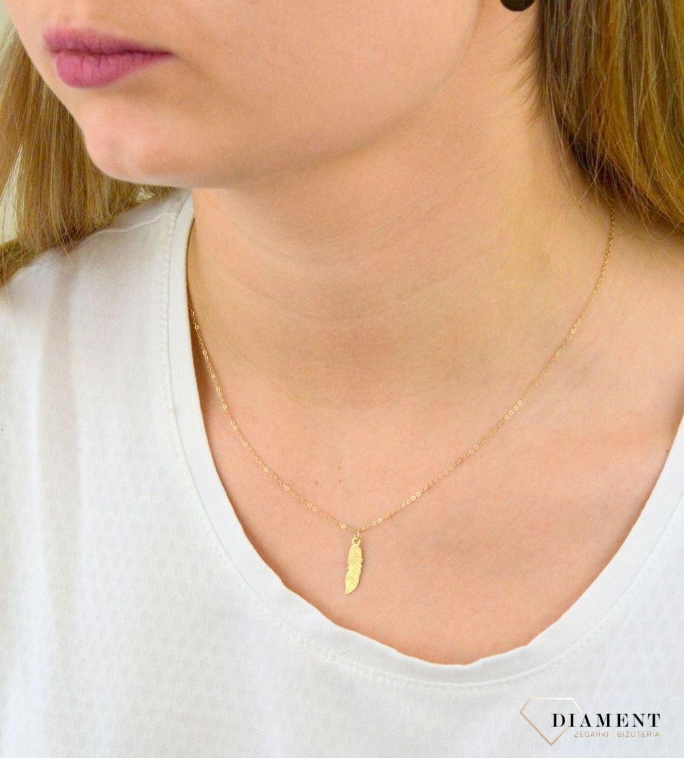 Naszyjnik celebrytka złota z piórkiem CEL172NG.jpg