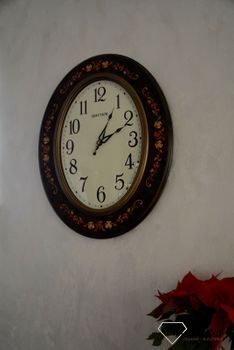Zegar na ścianę Rhythm drewniany owalny z wzorem CMG298NR06. Owalny duży zegar ścienny w kolorze brązowym. Obudowa wykonana z wytrzymałego drewna w kolorze brązowym (8).JPG