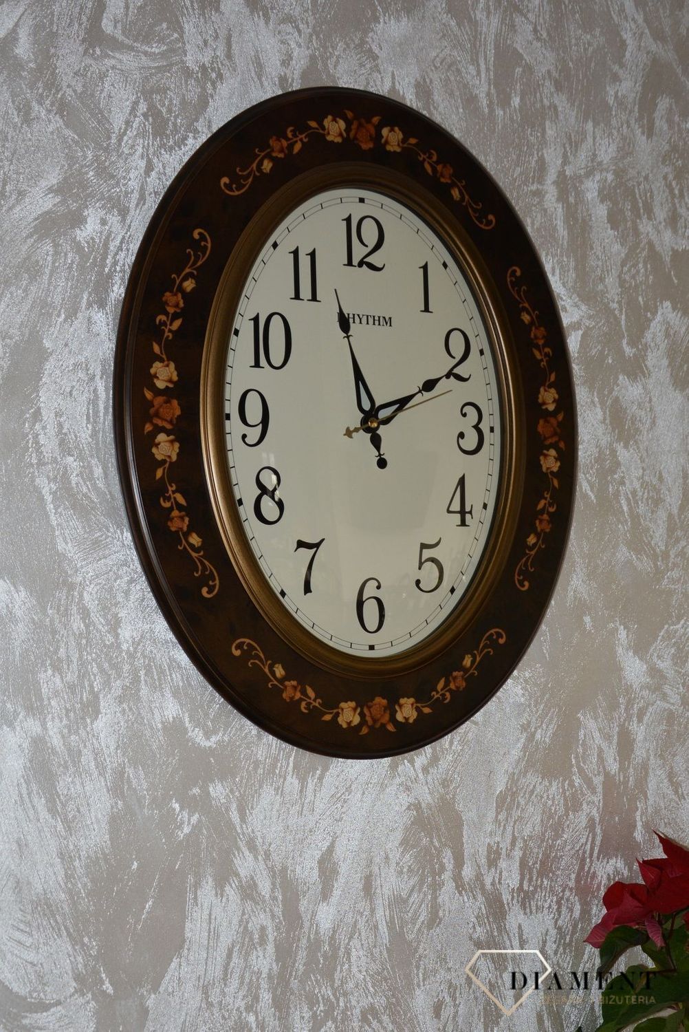 Zegar na ścianę Rhythm drewniany owalny z wzorem CMG298NR06 (2).jpg