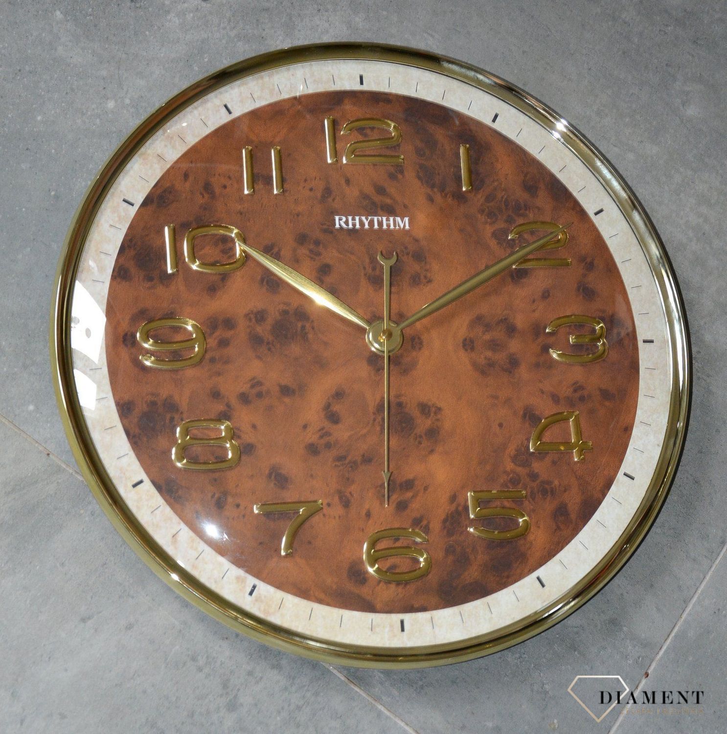 Zegar na ścianę do salonu Rhythm CMG584NR18 szklany 40 cm.jpg