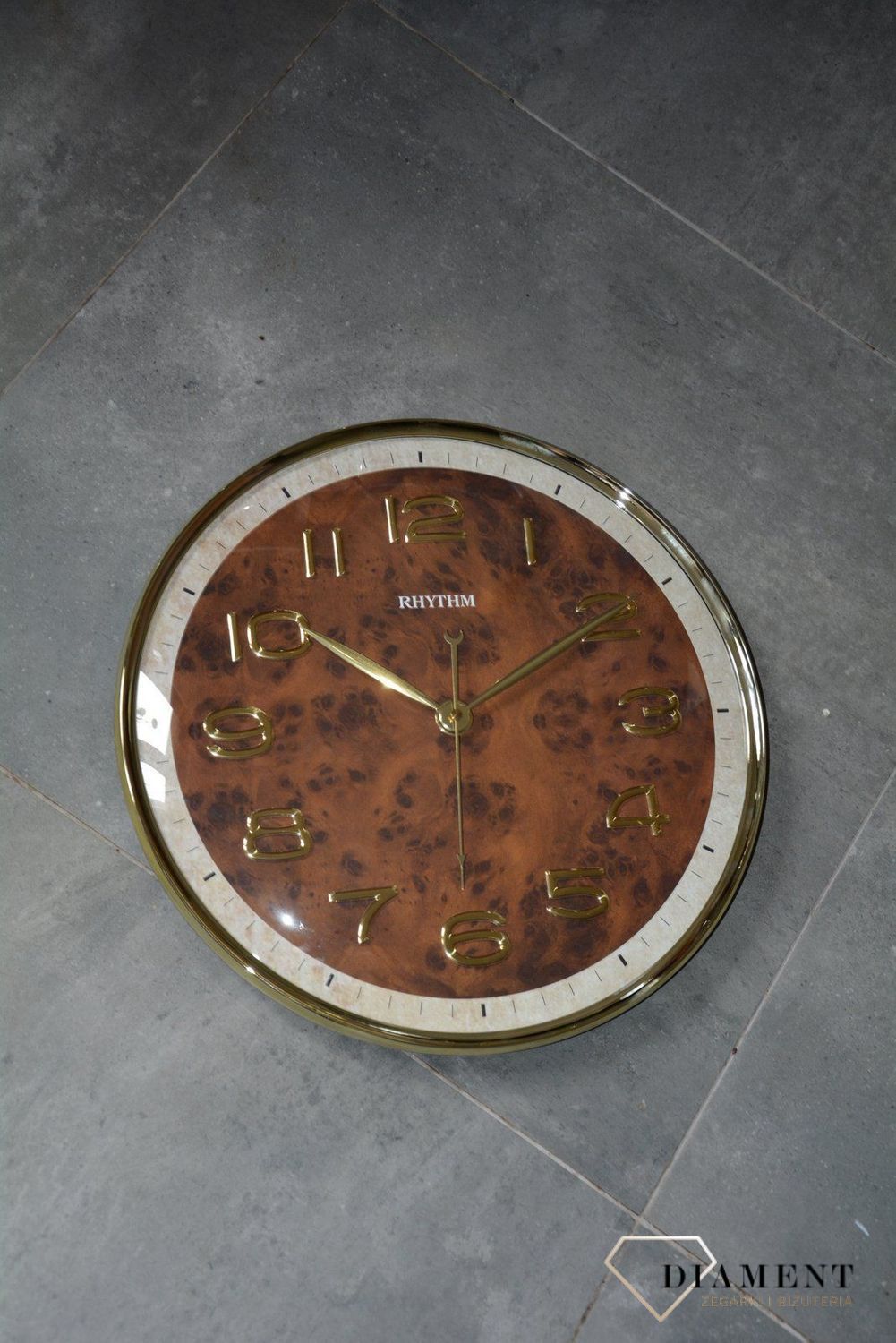 Zegar na ścianę do salonu Rhythm CMG584NR18 szklany 40 cm.jpg