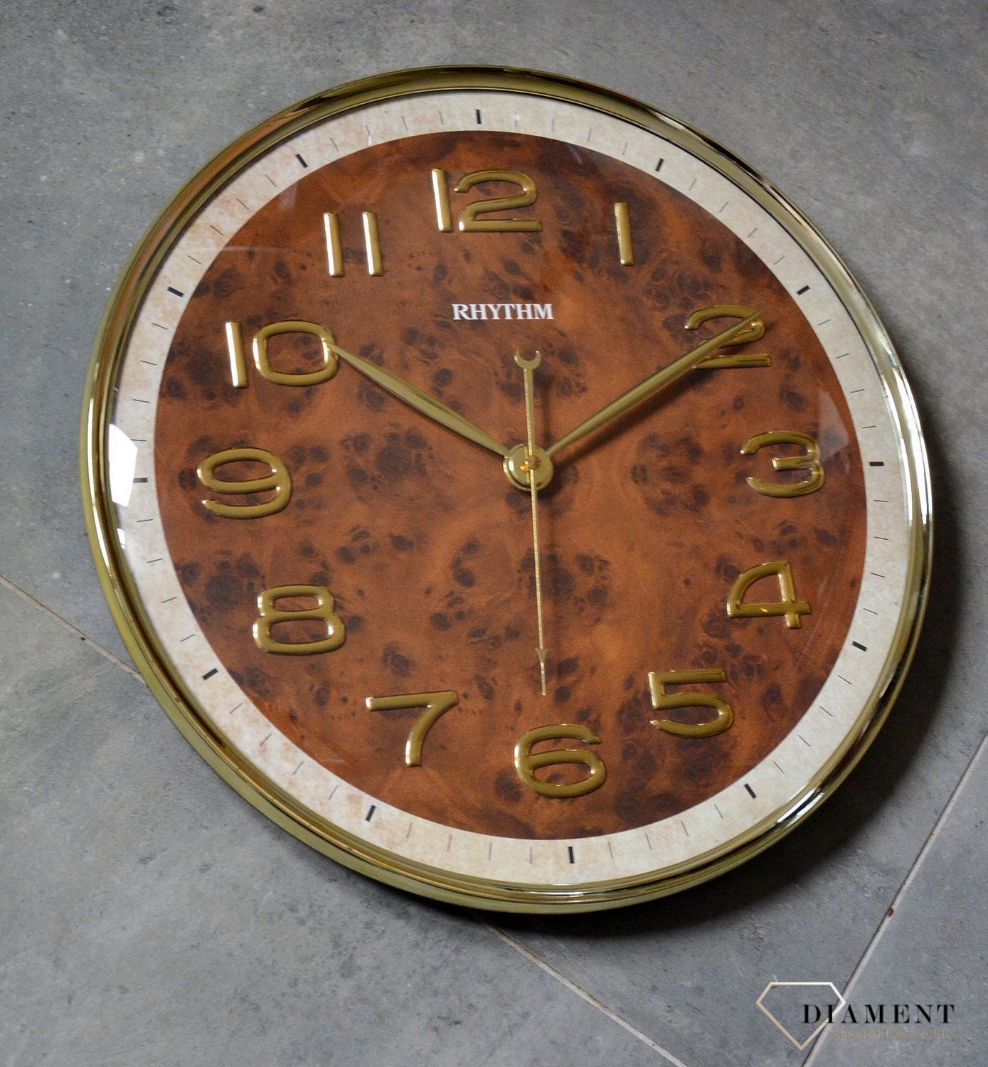 Zegar na ścianę do salonu Rhythm CMG584NR18 szklany 40 cm.jpg