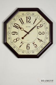 Zegar na ścianę do salonu duży ośmiokąt 48 cm CMG745NR06. Efektowny dekoracyjny zegar na ścianę w kształcie ośmiokąta. Beżowy cyferblat świetnie współgra z cyframi arabskimi i wskazówkami w kolorze brązowym ( (4).JPG