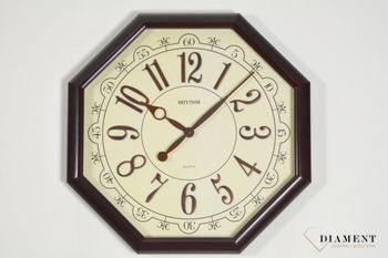Zegar na ścianę do salonu duży ośmiokąt 48 cm CMG745NR06. Efektowny dekoracyjny zegar na ścianę w kształcie ośmiokąta. Beżowy cyferblat świetnie współgra z cyframi arabskimi i wskazówkami w kolorze brązowym ( (5).JPG