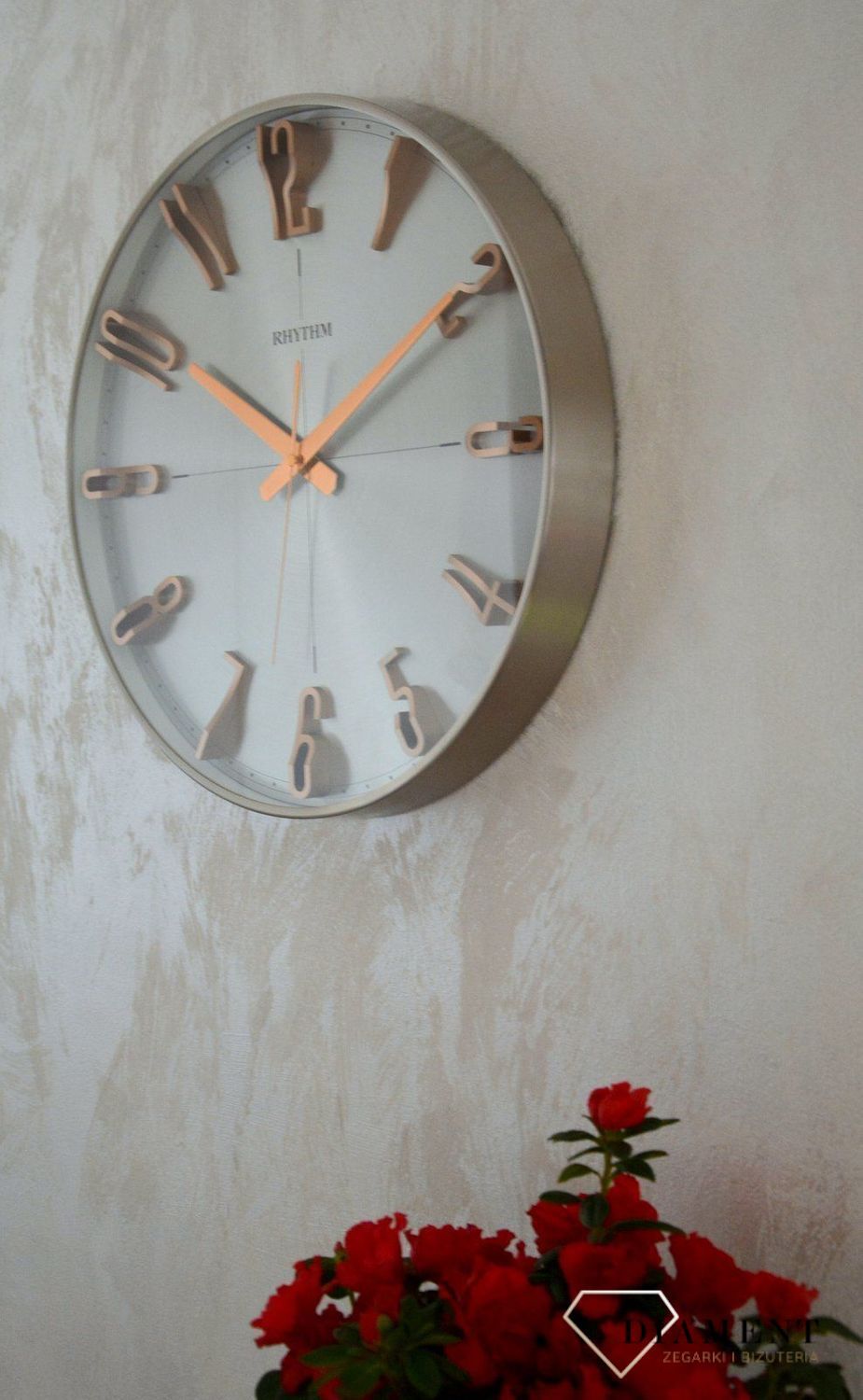 Zegar ścienny do salonu srebrny Rhythm z różowym złotem CMG554NR19.jpg