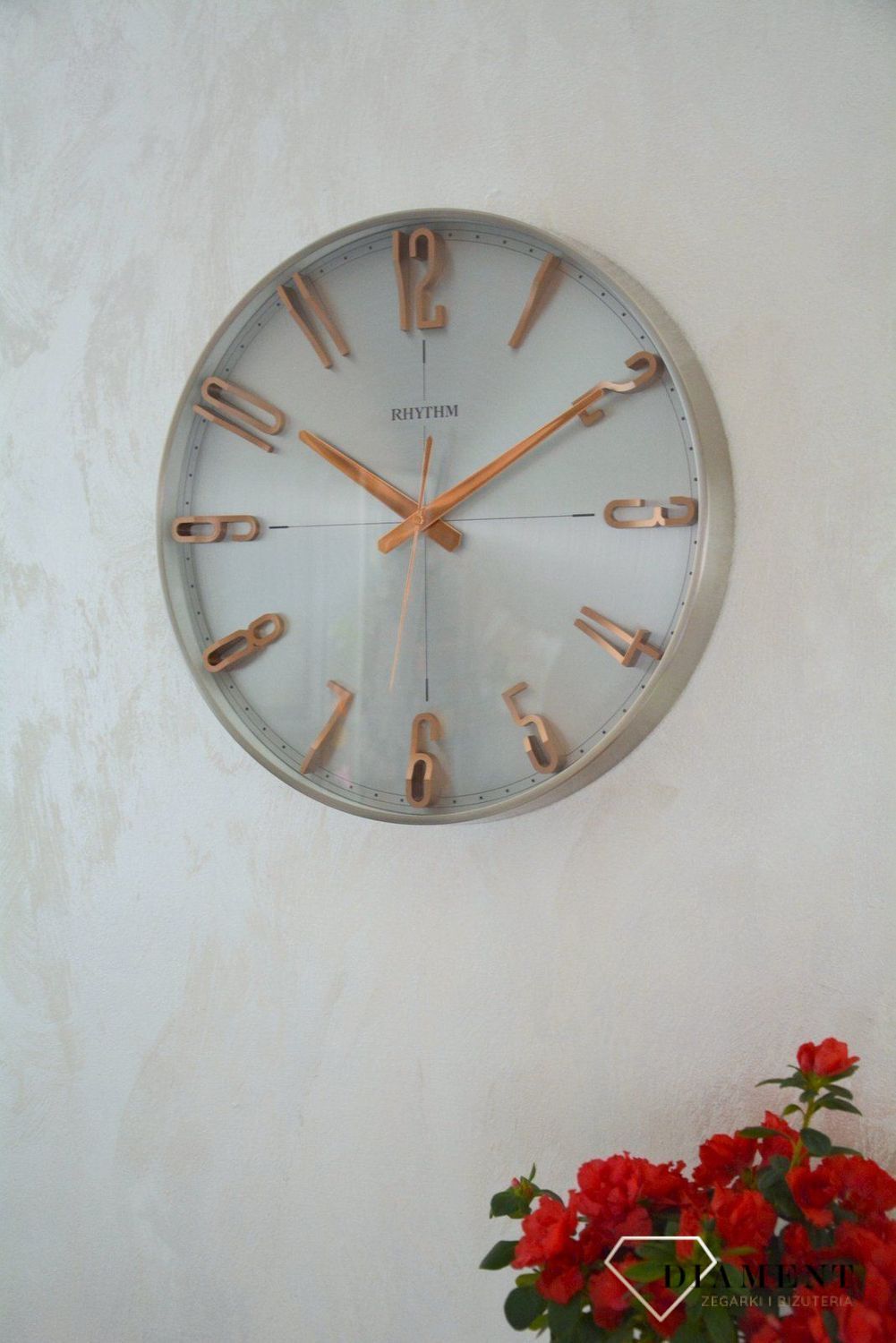 Zegar ścienny do salonu srebrny Rhythm z różowym złotem CMG554NR19.jpg