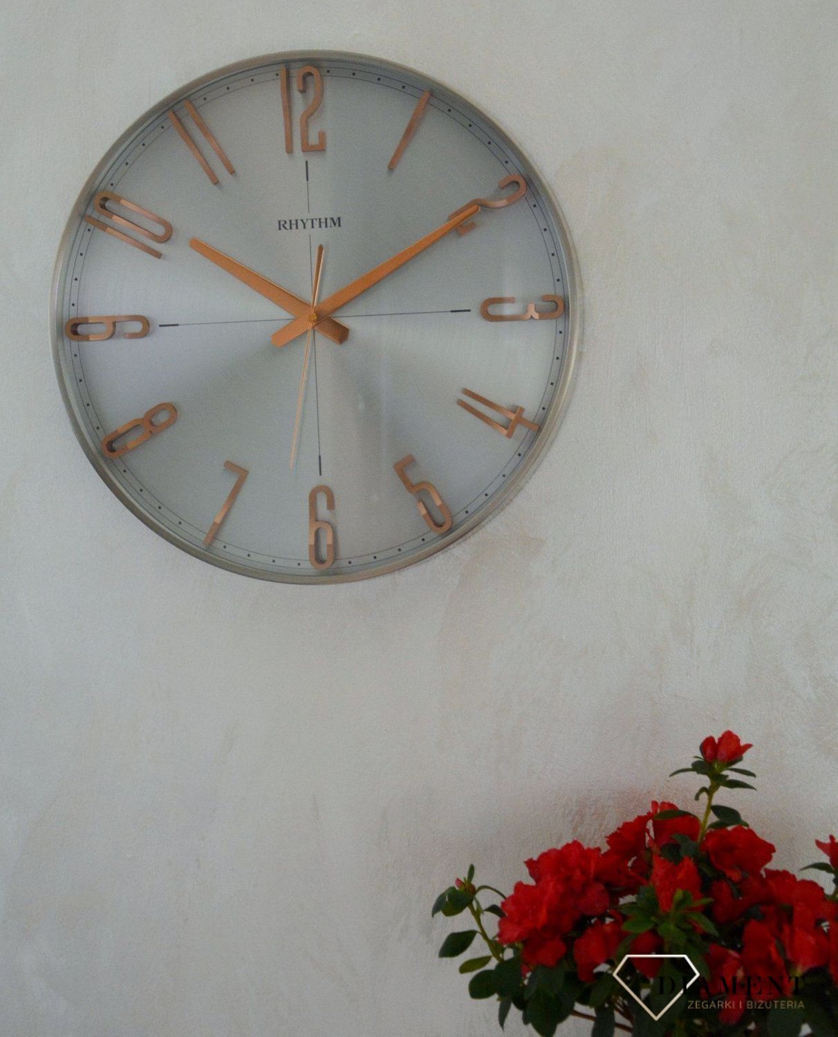 Zegar ścienny do salonu srebrny Rhythm z różowym złotem CMG554NR19.jpg