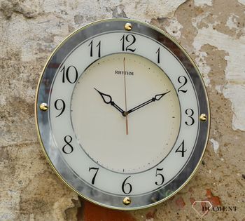 Zegar na ścianę do salonu Rhythm 'Złote lustro' to nowoczesny zegar na ścianę, który jest bardzo czytelny. Idealny na prezent na rocznicę Ślubu. Zegarki-diament (1).JPG