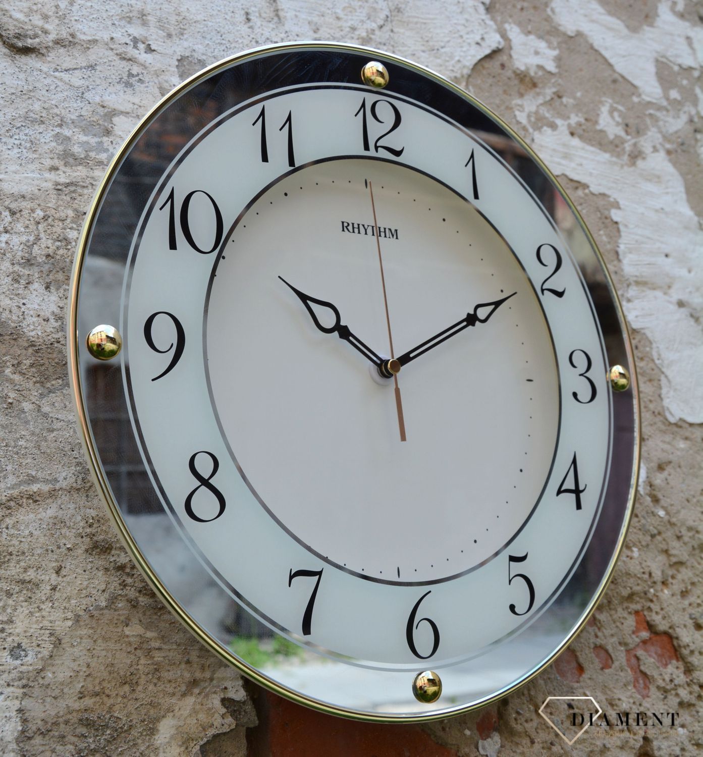 Zegar na ścianę do salonu Rhythm 'Złote lustro' to nowoczesny zegar na ścianę.jpg