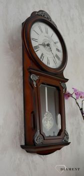 Zegar ścienny drewniany Rhythm zdobiony z wahadłem CMJ380CR06 🕰 Zegar ścienny wykonany z wysokiej jakości drewna w kolorze orzecha (5).JPG