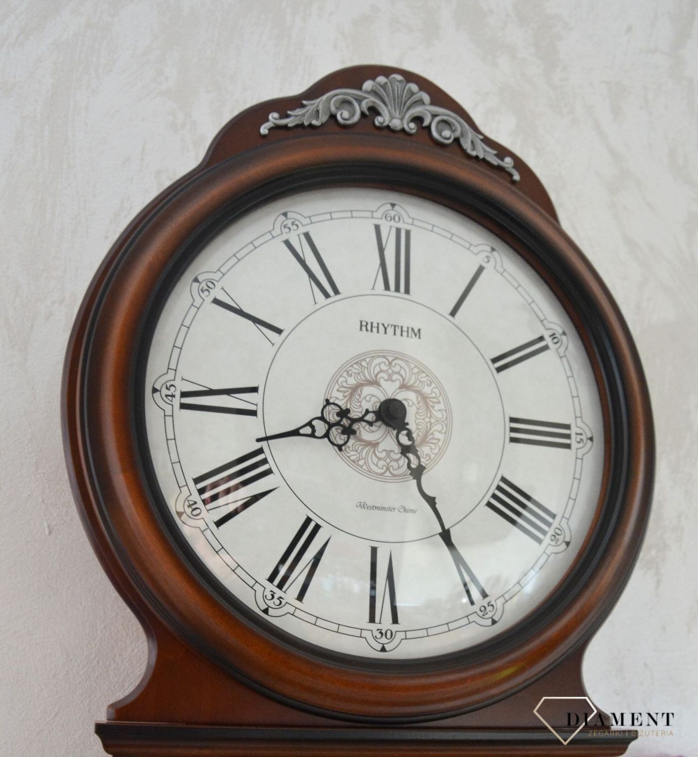 Zegar ścienny Rhythm drewniany zdobiony z wahadłem CMJ380CR06.jpg