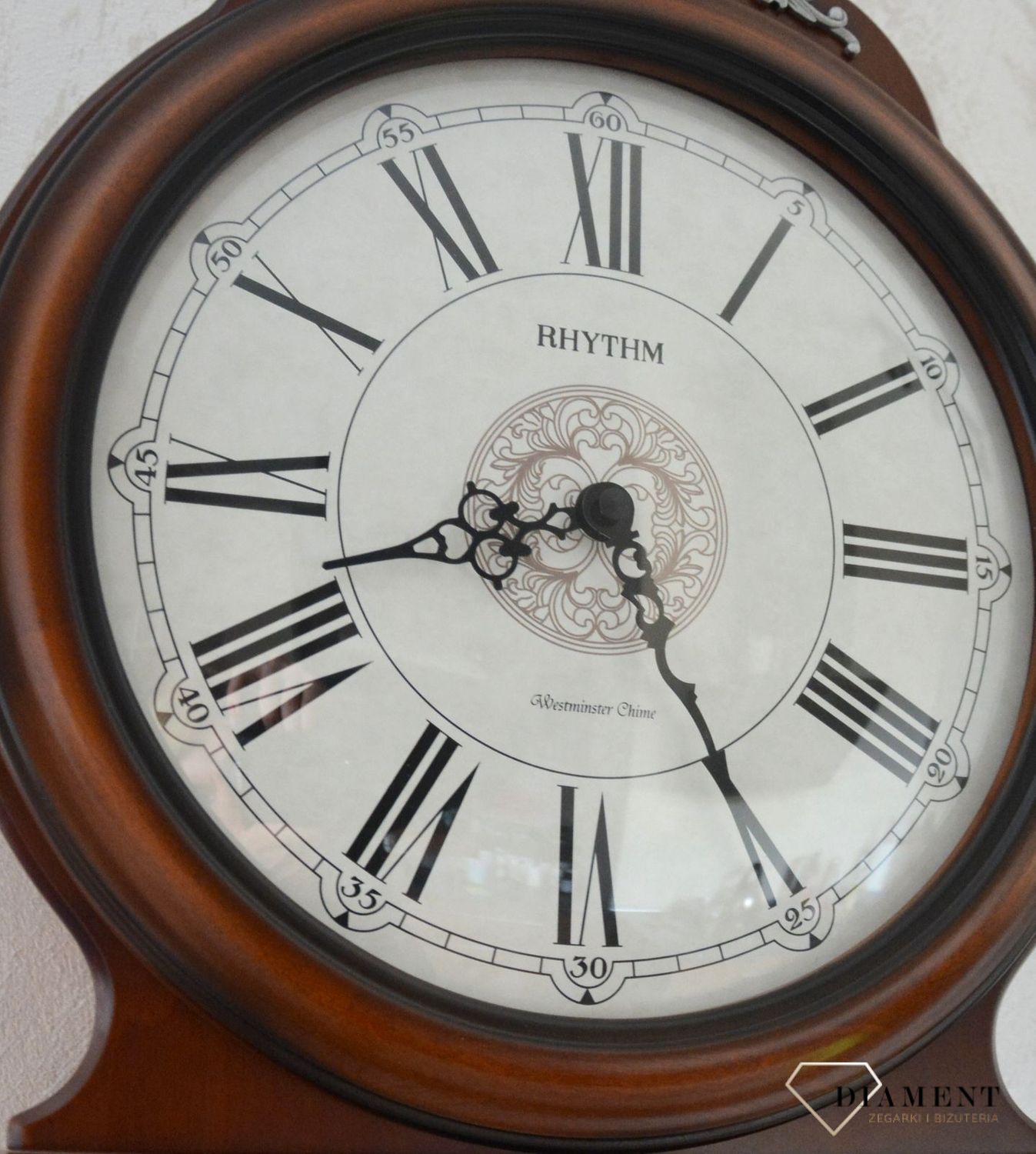 Zegar ścienny Rhythm drewniany zdobiony z wahadłem CMJ380CR06.jpg