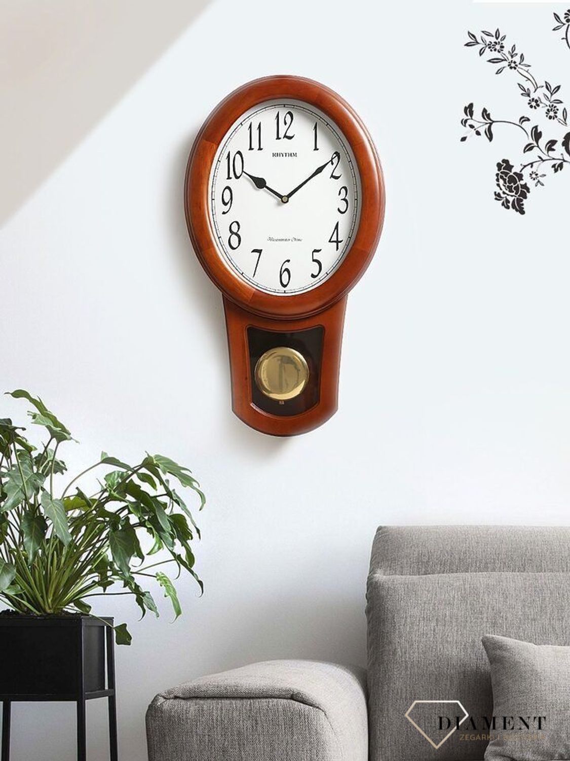 Zegar ścienny drewniany z wahadłem Rhythm CMJ576NR06.jpg