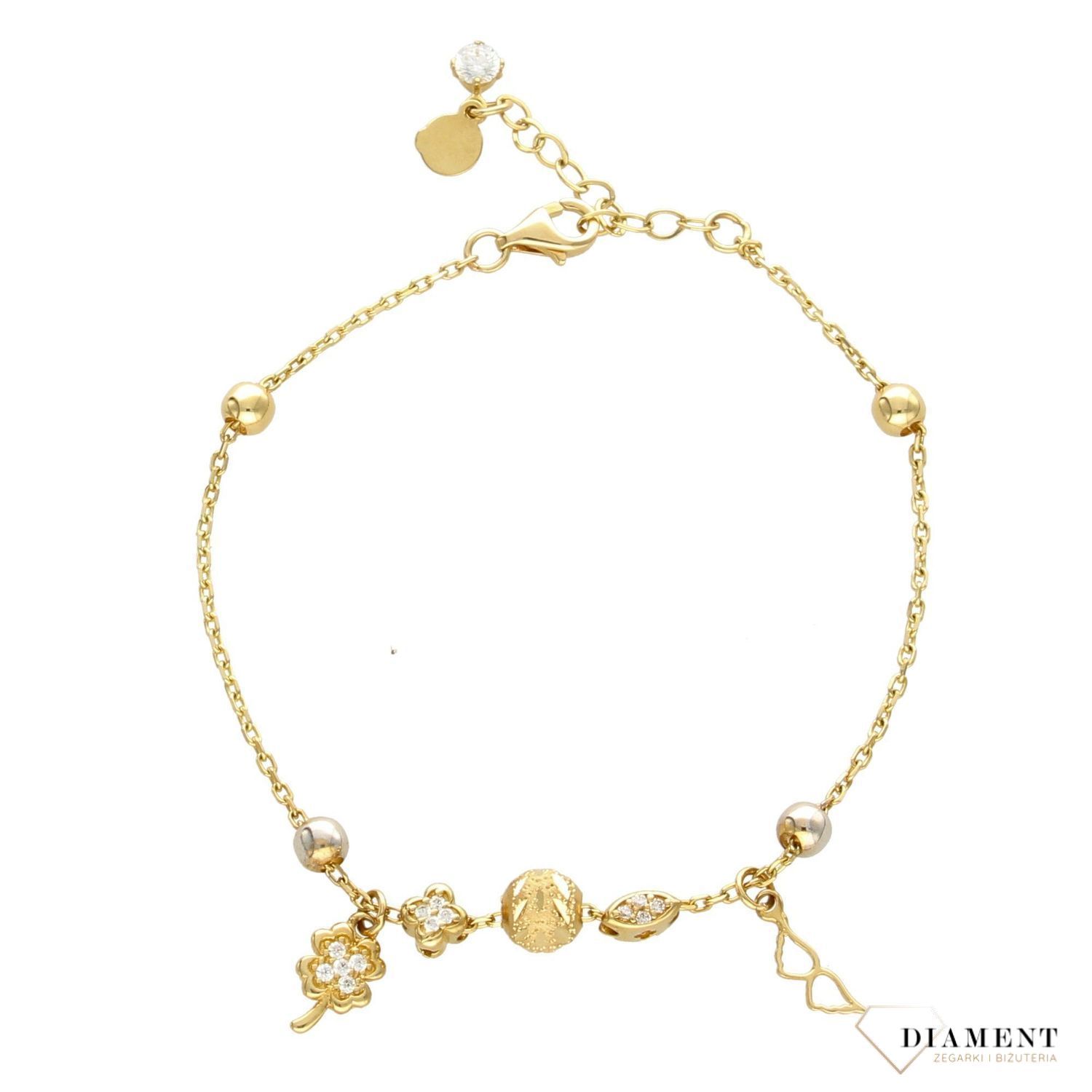 Złota bransoletka celebrytka z zawieszkami koniczynką i skrzydełkami. Złota bransoletka w kolorze żółtego złota wykonana z próby 585. Zapraszamy!  (1).jpg